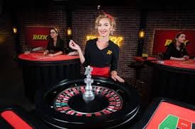 Mobile phone showing pasarpoker slots interface with Aviator and Sweet Bonanza game tiles
